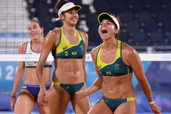 Australia’s Mariafe Artacho del Solar #1 and Taliqua Clancy #2 react after defeating Italy in the beach volleyball preliminary round on Wednesday.