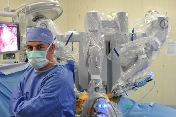 Professor Declan Murphy with a surgical robot.
