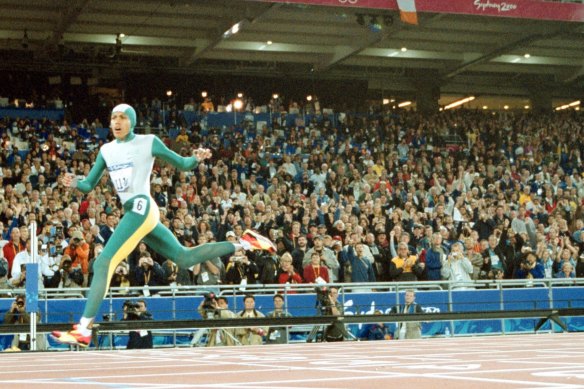 Cathy Freeman crosses the line to win gold at the Sydney 2000 Olympics.