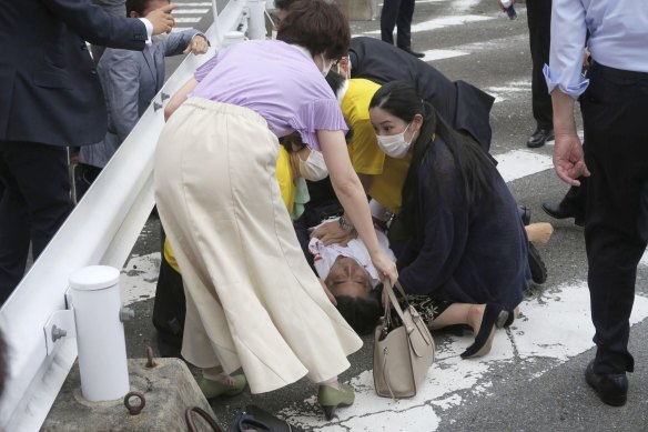 People attend to  former Japanese prime minister Shinzo Abe, after he was shot in Nara.