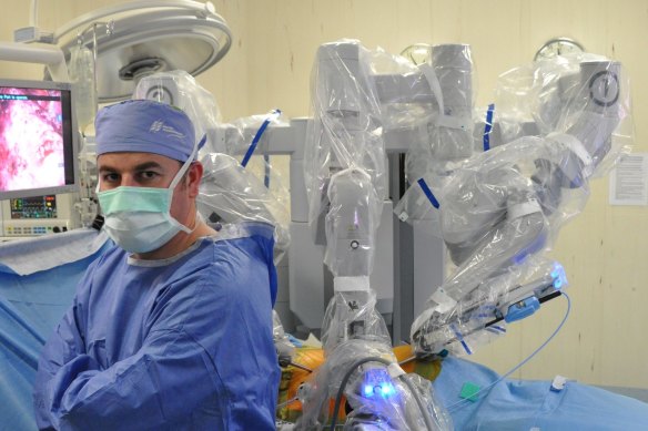 Professor Declan Murphy with a surgical robot.