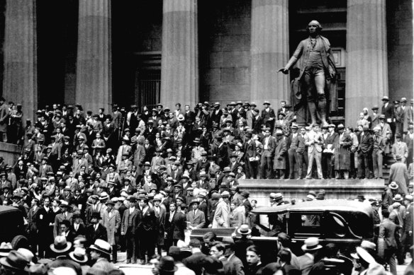 People gather across the street from the New York Stock Exchange in New York Oct.  24, 1929.