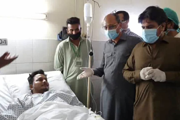 Mohammad Zubair, pictured in a hospital bed, survived the plane crash in Karachi.