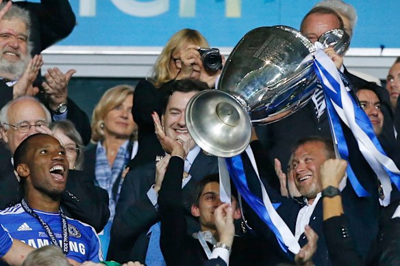 Roman Abramovich lifts the Champions League trophy with Chelsea in 2012.