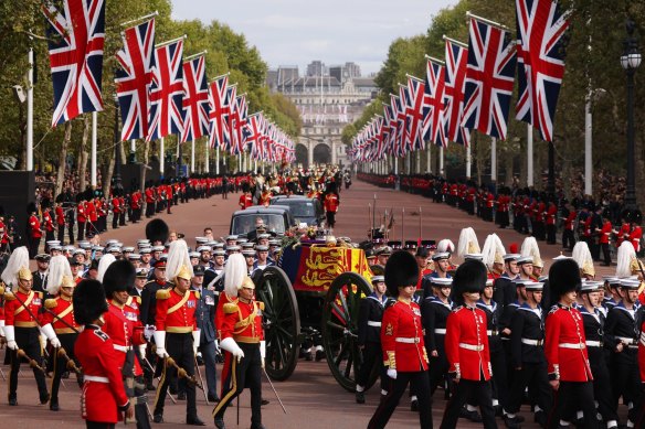 The Queen’s funeral cortege borne on the State Gun Carriage of the Royal Navy travels along The Mall.