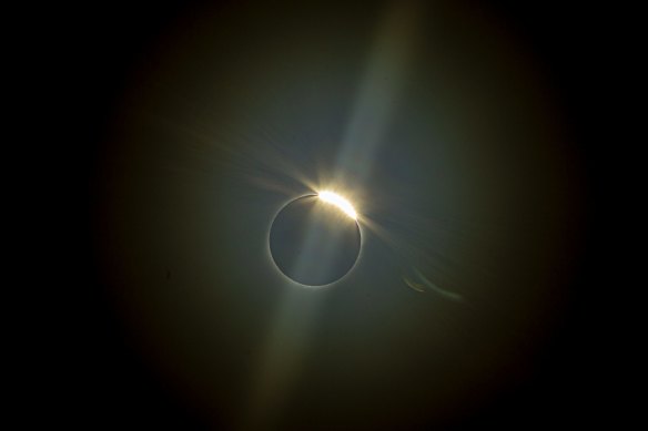 Right before totality, a “diamond ring” effect occurs as the last of the unobscured sun bursts through valleys on the moon.