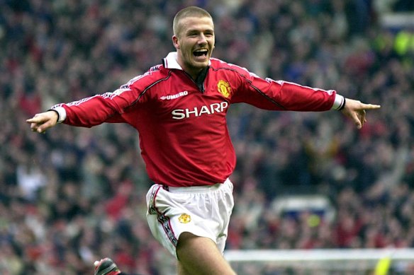 Beckham celebrates after scoring for Manchester United in 2000.