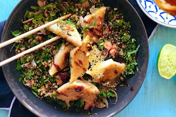 Lacy potsticker dumplings on a bed of roasted cauliflower, herb and pickled ginger salad.