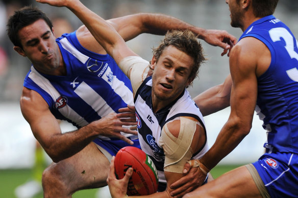 Geelong’s Billie Smedts is tackled.