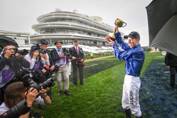 Kerrin McEvoy celebrates with the 2018 Melbourne Cup.