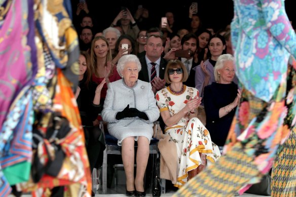 Queen Elizabeth (left) with Vogue fashion editor Anna Wintour at Richard Quinn’s runway show at London Fashion Week in 2018