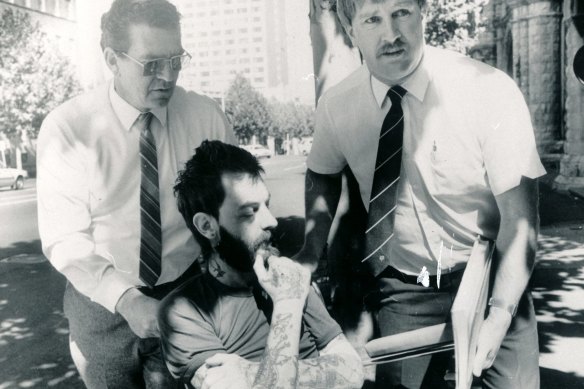 Dennis Bruce Allen, dying of a rare heart disease, is wheeled into court by homicide squad detectives after being charged with the murder of Wayne Stanhope in August 1984. Stanhope's body was never found. Allen died less than five weeks later in hospital. 