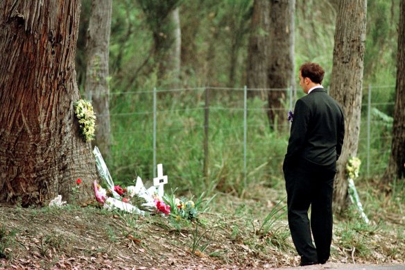 Walter Mikac in front of the tree where his daughter was killed at the one-year memorial service of the Port Arthur massacre.