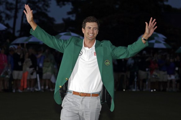 Adam Scott, of Australia, shows off his green jacket after winning the Masters in 2013.