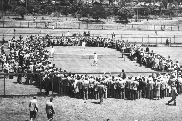 Lew Hoad and Ken Rosewall practise at Kooyong before their Davis Cup final in 1953. Coach Harry Hopman watches from the sidelines. 