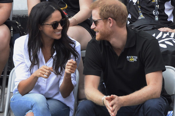 Harry and Meghan at the Invictus Games in 2017, not long after Tominey broke the story of their relationship,