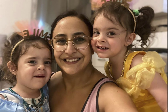 Sharon Aloni Cunio, centre, and her twin daughters, Emma and Yuli, 3, were released on Monday, local time.