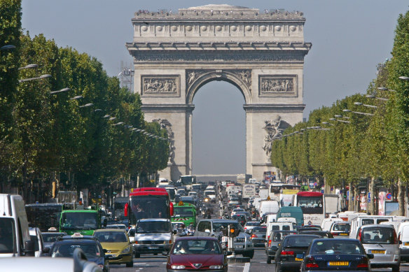 The roundabout of the Arc de Triomphe in Paris, approached from the Avenue de Champs-Elysees.