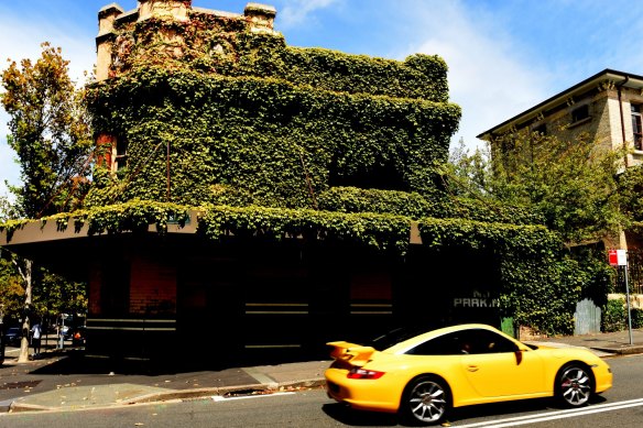 The Terminus Hotel, pictured here in 2016, laid dormant for more than 30 years and was covered in moss and twines.