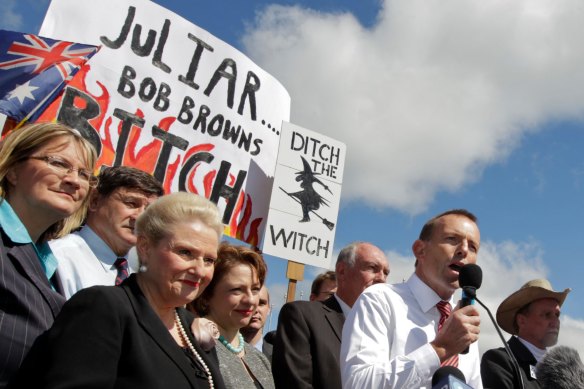 Then opposition leader Tony Abbott speaks at a 'No carbon tax rally' outside Parliament House in  Canberra in 2011.