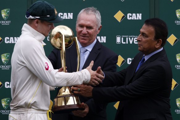 Old firm: Steve Smith receives the Border-Gavaskar Trophy from Allan Border and Sunil Gavaskar after Australia won the series 2-0 in 2015.