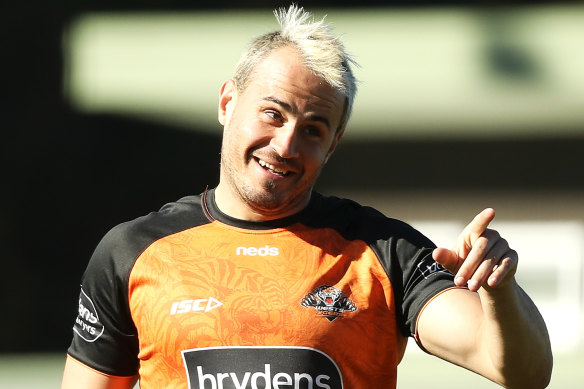 Better days: Josh Reynolds shares a laugh with his Wests Tigers mates earlier this month.