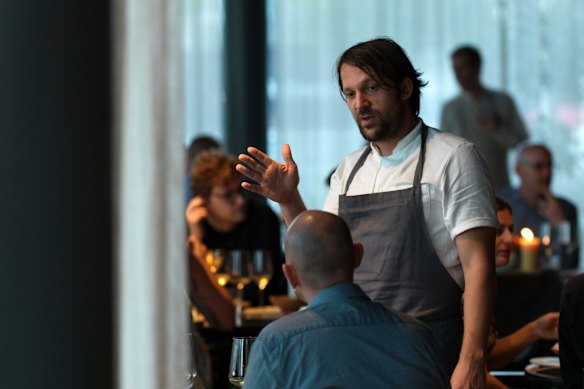 Chef Rene Redzepi talks to a diner at Noma.