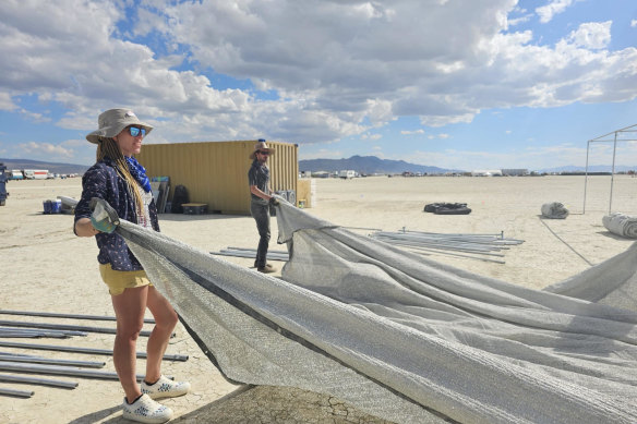 Festivalgoers setting up the Alborz camp for about 100 people, including five Australians.