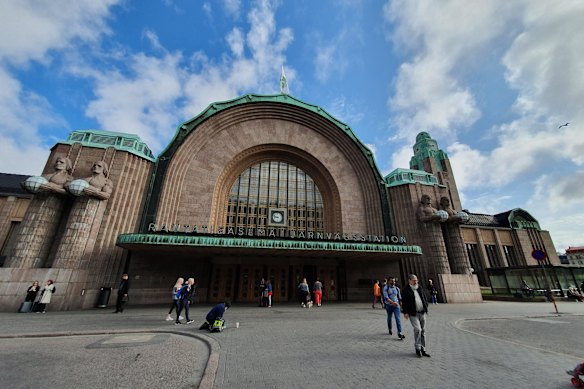 An art nouveau jewel … Stone twins bookend the entrance to Helsinki Central Station.