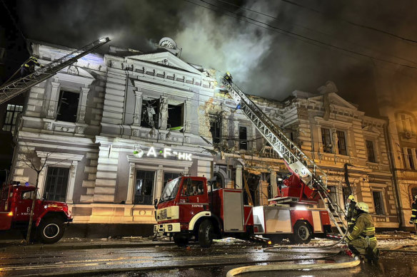 Firefighters put out a fire after a Russian missile attack in Kharkiv, Ukraine.