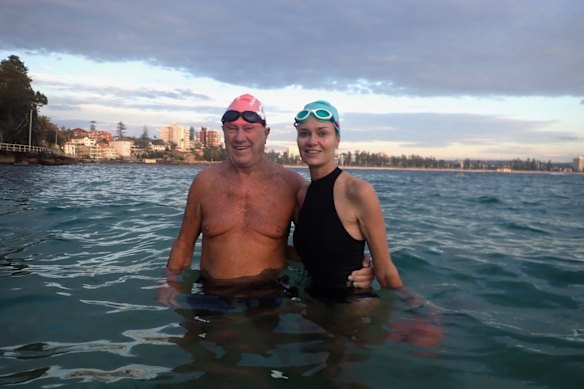 Julia Baird and her father, Bruce Baird, in the ocean. 
