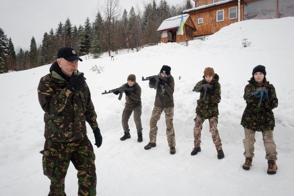 Vadim Kirov, of Skole in Ukraine, teaches 11 teenagers how to hold a weapon as Western intelligence offices warn that the Russian invasion is imminent. 