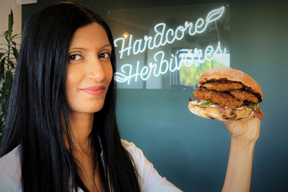 Shama Sukul Lee, the founder of Sunfed, with a burger made using her “chicken-free chicken” product.