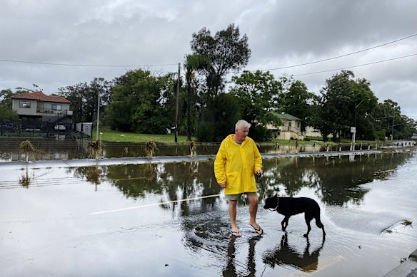 Chipping Norton resident Bernie King inspecting the flooding along Newbridge Road on Thursday. 