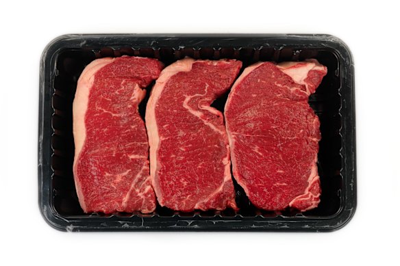 Supermarket meat on a non-recyclable black tray. 