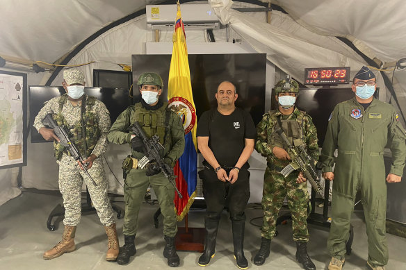 “Otoniel”, leader of the violent Clan del Golfo cartel, centre, is presented to the media at a military base in Necocli, Colombia.