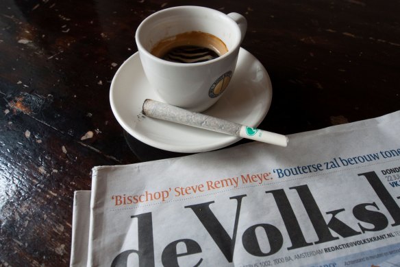 A joint of cannabis and cup of coffee at the Amsterdam coffeeshop in The Netherlands.
