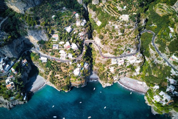 Colourful Positano rises from the sea.