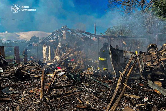Firefighters extinguish a fire following Russia’s air raid in the village of Bilopillya in the Sumy region, Ukraine, on May 14.