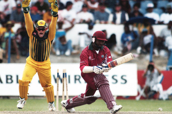 1999: Australian keeper Adam Gilchrist celebrates after West Indies captain Brian Lara is bowled by Shane Warne in an ODI between Australia and the West Indies in Trinidad & Tobago. 