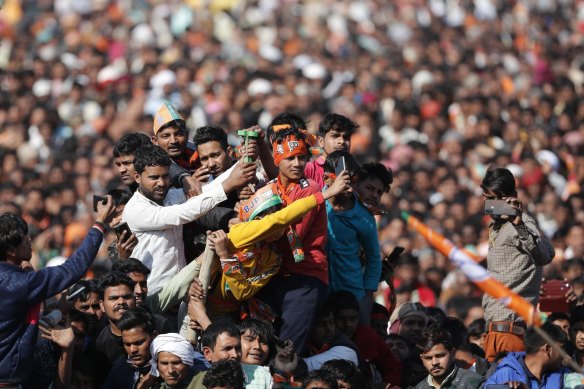 Supporters gather at an election rally addressed by Uttar Pradesh Chief Minister Yogi Adityanath and Indian Prime Minister Narendra Modi ahead of state elections in Kasganj, Uttar Pradesh, India.