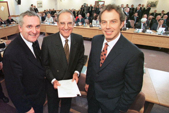 Then Irish prime minister Bertie Ahern, US senator George Mitchell and British prime minister Tony Blair pose after signing the Good Friday Agreement for peace in Northern Ireland in 1998.