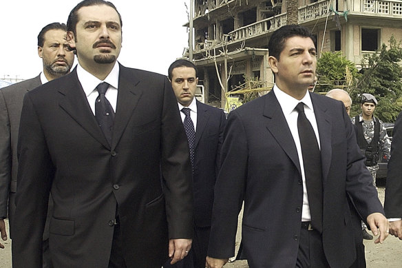 Bahaa Hariri, right, and Saad Hariri, sons of Lebanese prime minister Rafik Hariri, visit the scene where their father was assassinated in Beirut in 2005.