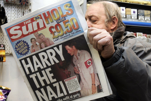 File photo from 2005 showing a newspaper report on Harry wearing a Nazi costume to a fancy dress party.