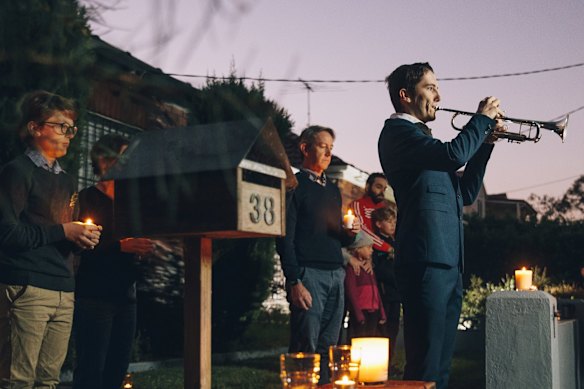 Albie Woodhouse plays The Last Post on trumpet for a driveway dawn service for ANZAC Day in 2020.