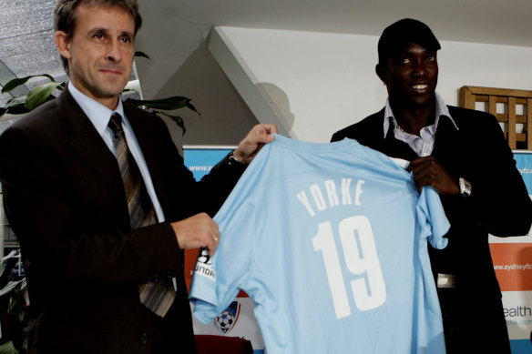Dwight Yorke (right) during his days with Sydney FC, pictured with then coach Pierre Littbarski.