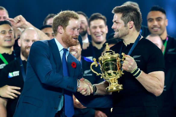 Prince Harry presents Richie McCaw with the Webb Ellis Cup after New Zealand’s 2015 Rugby World Cup final win over Australia at London’s Twickenham Stadium.