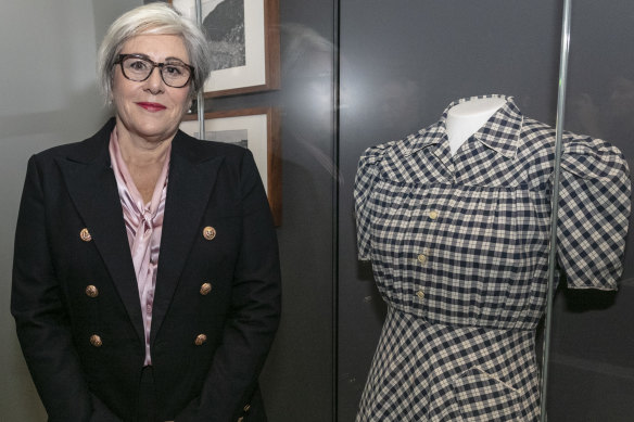 Naomi Shaw with her mother Henryka Shaw's dress  that is on display at the Australian War Memorial. Henryka  wore the dress when she was liberated from the Mauthausen concentration camp on May 9, 1945.

