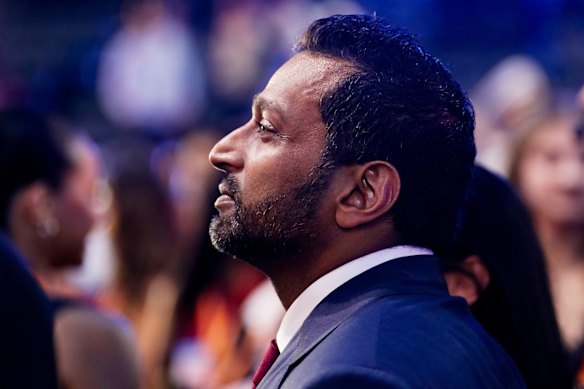 FBI director Kash Patel watches the event.