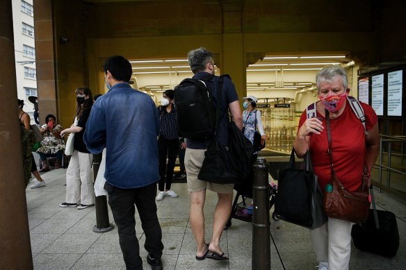 Commuters at one of the closed entrances at Central Station.